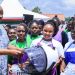 Nyamira Governor Amos Nyaribo (centre) presents a working toolkit to one of the best well performed VTC graduate at Mwongori VTC.